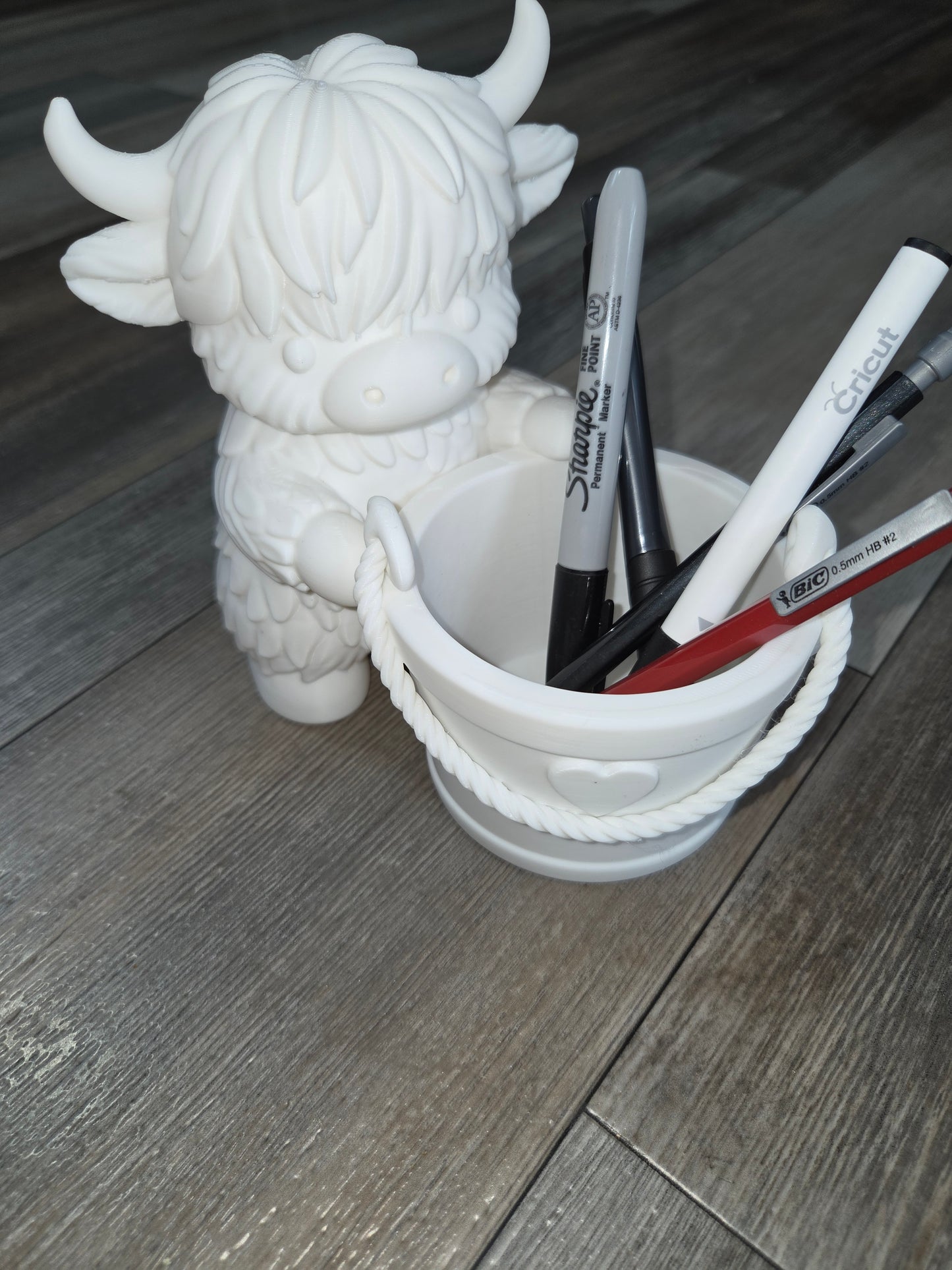 Cow with bucket pen holder